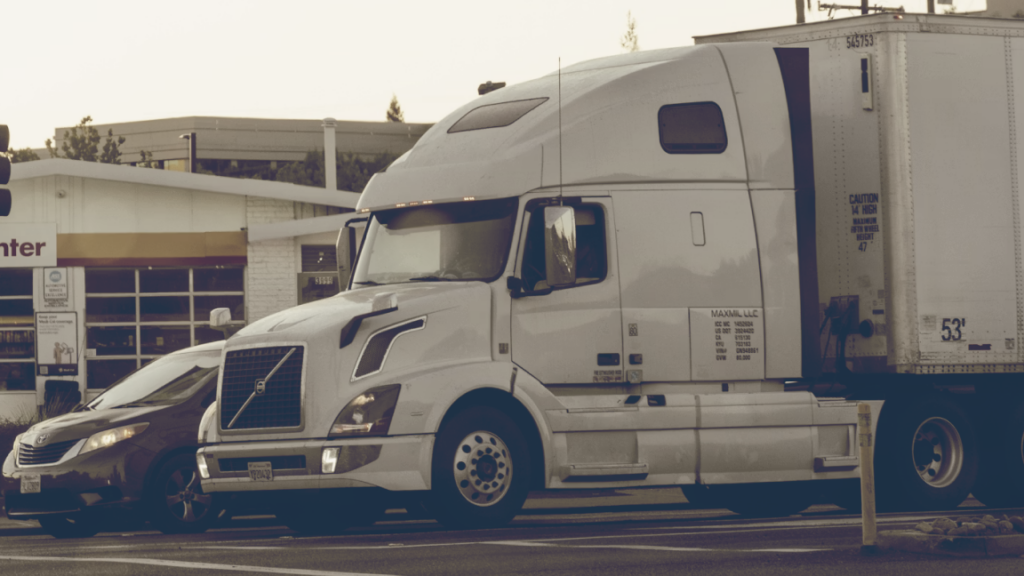 MC number phase-out and FMCSA Motus registration transition graphic showing a commercial carrier reviewing USDOT authority records.