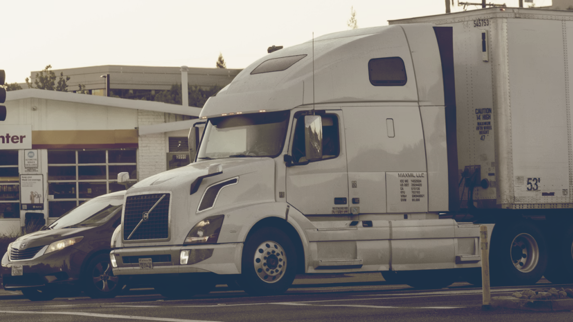MC number phase-out and FMCSA Motus registration transition graphic showing a commercial carrier reviewing USDOT authority records.